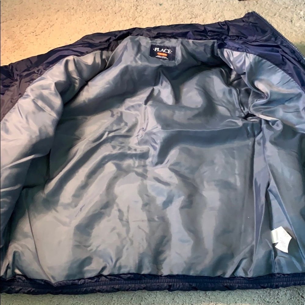 A navy blue children’s Place coat